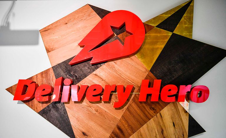 2017-06-27 11:27:50 A view of a logo in a lounge area of the global headquarters of online food ordering and delivery giant Delivery Hero is pictured in Berlin on June 27, 2017. Germany-based online food ordering service Delivery Hero plans a Frankfurt stock market flotation on June 30, 2017 saying investors' cash will help it expand further around the world. / AFP PHOTO / John MACDOUGALL