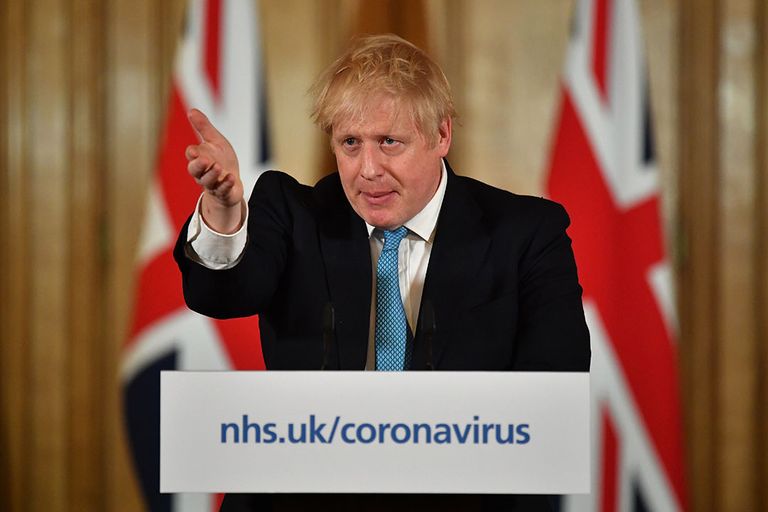 De Britse premier Boris Johnson. De Engelse regering heeft nog geen horeca-sluiting afgekondigd vanwege het coronavirus. - Foto: ANP
