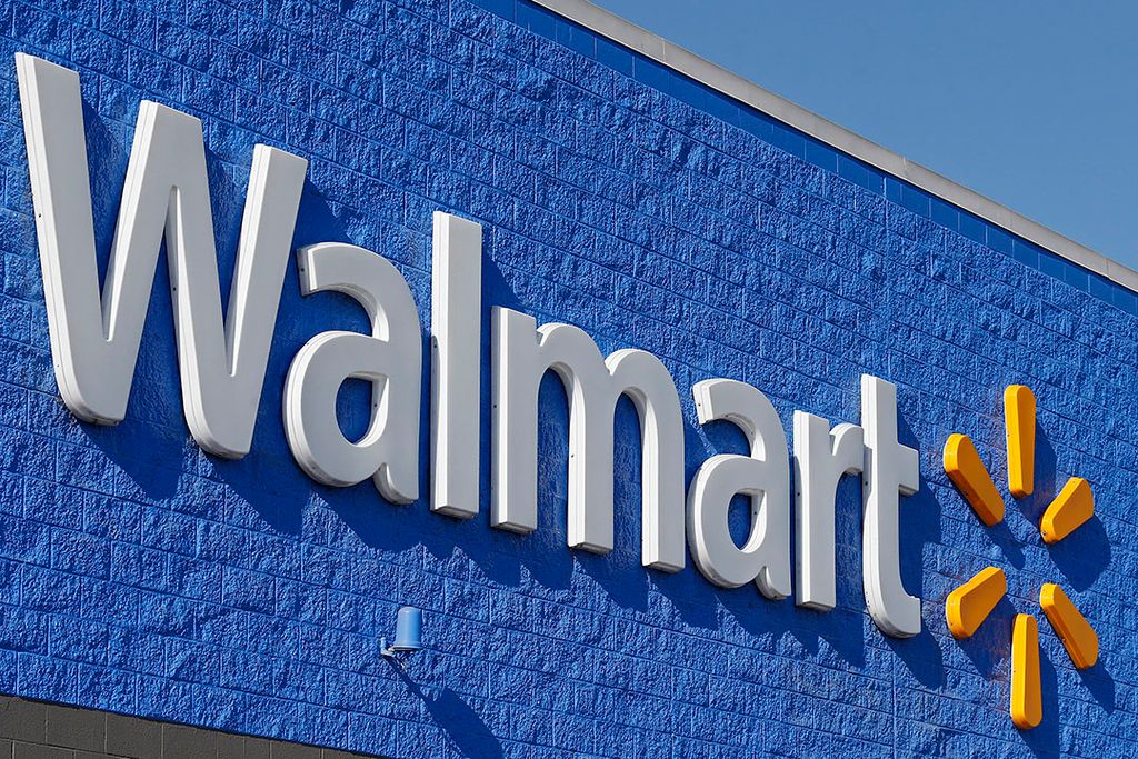 Het logo van Walmart aan de buitenkant van een winkel in Sulphur Springs in de Verenigde Staten. - Foto: ANP